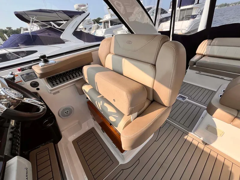 Slide: The Image of 2014 Regal 35 Sport Coupe interior with beige seating and modern dashboard. - 29