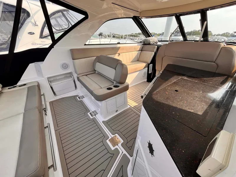 Slide: The Image of 2014 Regal 35 Sport Coupe interior with seating and sleek design. - 34