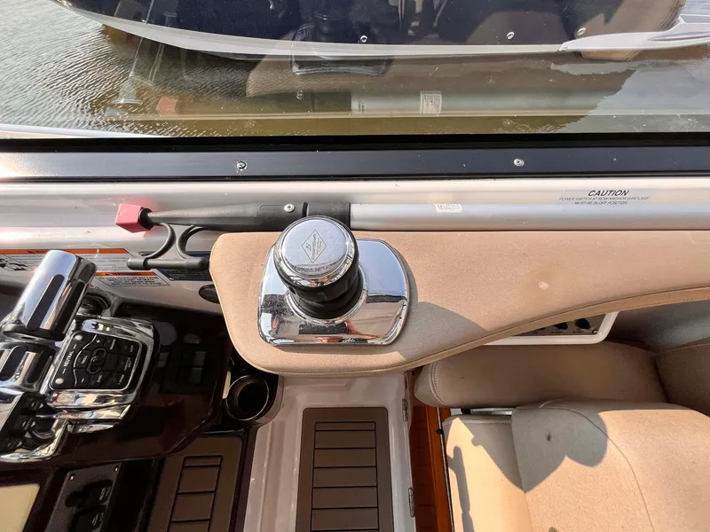 Slide: The Image of 2014 Regal 35 Sport Coupe helm with control panel and steering knob. - 38