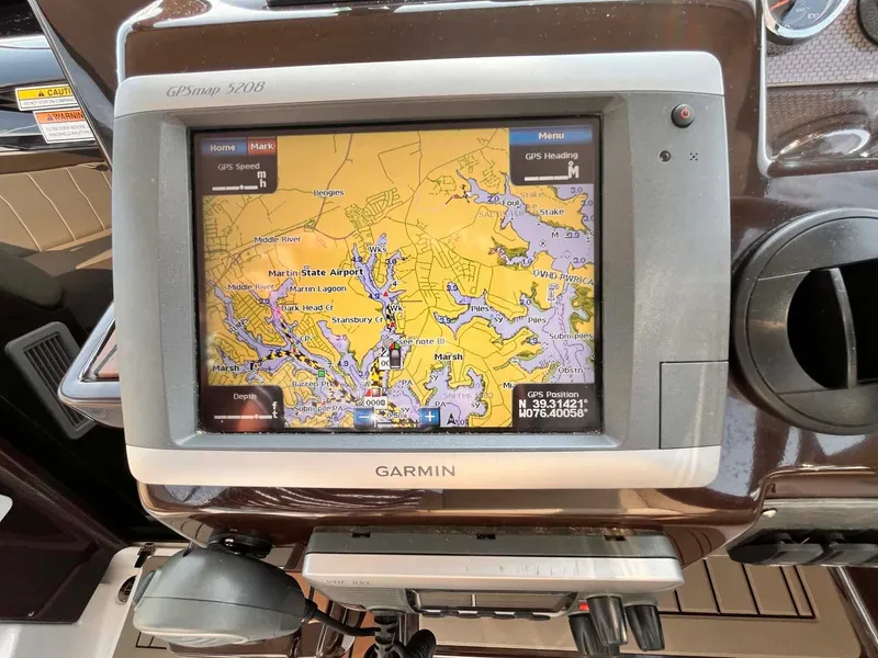 Slide: The Image of Garmin GPS navigation system on 2014 Regal 35 Sport Coupe boat dashboard. - 40