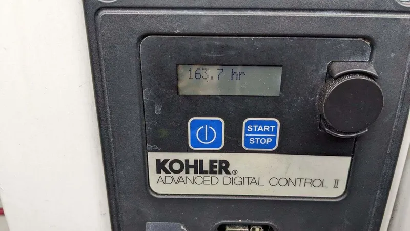 Slide: The Image of Kohler Advanced Digital Control II displaying 165.7 hours on a Regal 35 Sport Coupe, 2014. - 42