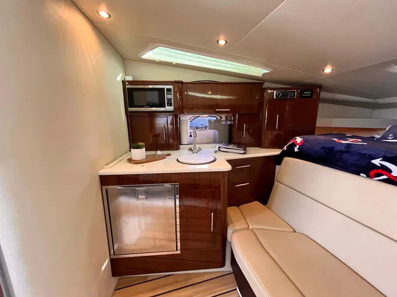 Slide: The Image of Interior of 2014 Regal 35 Sport Coupe with kitchenette and seating area. - 45