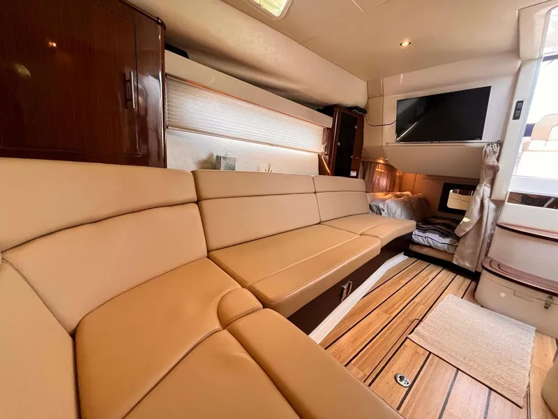 Slide: The Image of Luxurious interior of 2014 Regal 35 Sport Coupe with beige seating and wood flooring. - 47