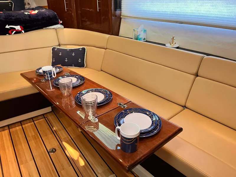 Slide: The Image of Luxurious interior of 2014 Regal 35 Sport Coupe with elegant dining setup. - 49
