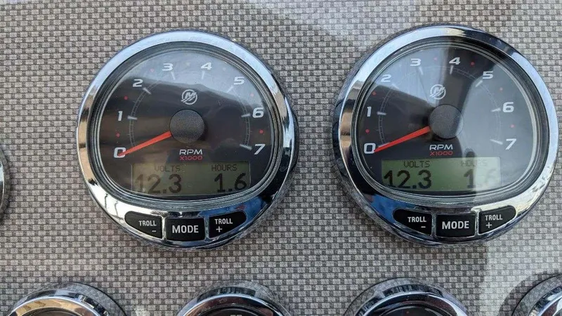 Slide: The Image of Dashboard gauges of a 2014 Regal 35 Sport Coupe boat showing RPM and mode settings. - 6