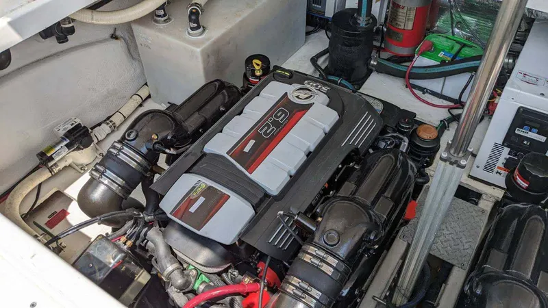 Slide: The Image of Engine compartment of a 2014 Regal 35 Sport Coupe boat, showcasing its powerful engine setup. - 9