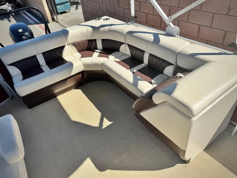 Slide: The Image of Luxurious seating on 2023 Lexington 321 CRUISE boat, featuring plush, modern upholstery. - 15