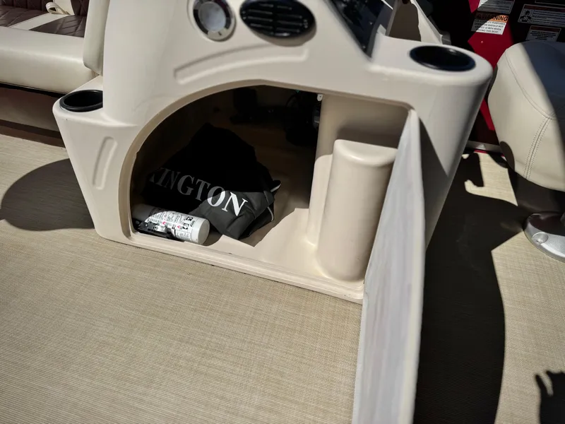 Slide: The Image of 2023 Lexington 321 CRUISE boat interior with storage compartment and accessories. - 23