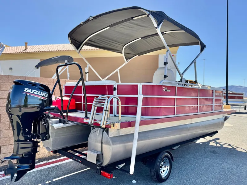 Slide: The Image of 2023 Lexington 321 CRUISE pontoon boat with Suzuki outboard motor and canopy. - 6