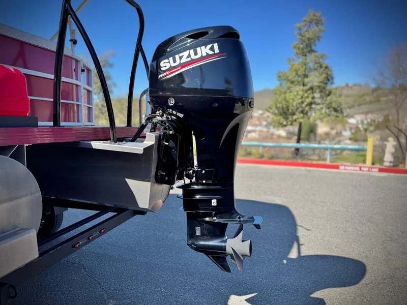 Slide: The Image of 2023 Lexington 321 CRUISE with Suzuki outboard motor in sunny outdoor setting. - 7
