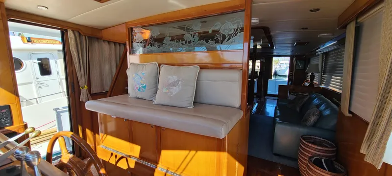 Slide: The Image of Interior of 2000 Jefferson Marquessa 60 MY yacht with wooden accents and seating area. - 12