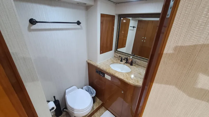 Slide: The Image of Bathroom interior of 2000 Jefferson Marquessa 60 MY yacht, featuring sink and toilet. - 17