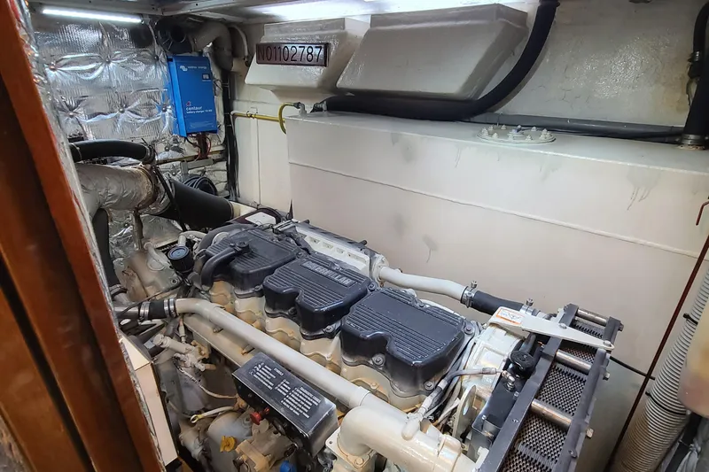 Slide: The Image of Engine room of a 2000 Jefferson Marquessa 60 MY yacht, showcasing mechanical components. - 21