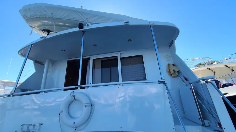 Slide: The Image of Jefferson Marquessa 60 MY yacht, 2000 model, rear view with lifebuoy and canopy. - 26