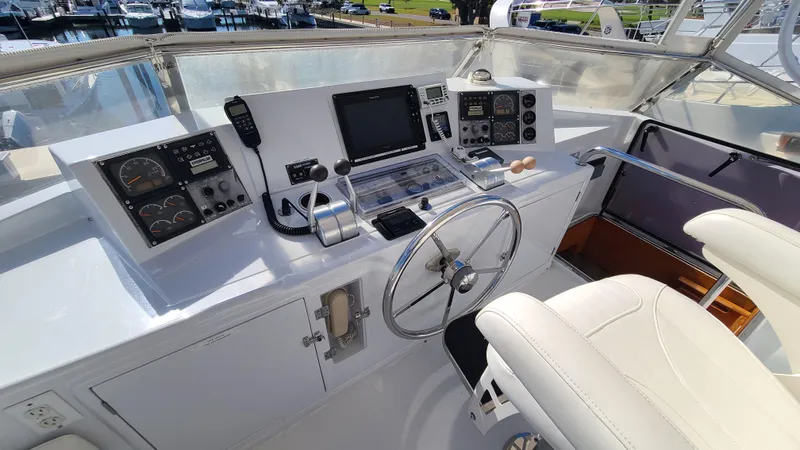 Slide: The Image of Helm of 2000 Jefferson Marquessa 60 MY yacht with navigation controls and steering wheel. - 29