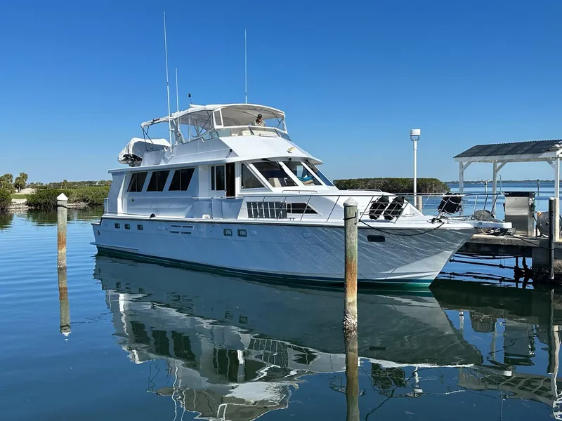 Slide: The Image of 2000 Jefferson Marquessa 60 MY yacht docked on calm water under clear blue sky. - 3
