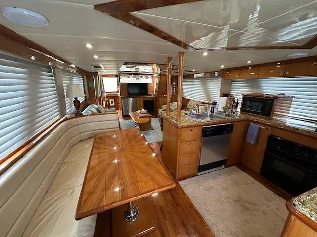 Slide: The Image of Luxurious interior of 2000 Jefferson Marquessa 60 MY yacht with modern kitchen and dining area. - 8