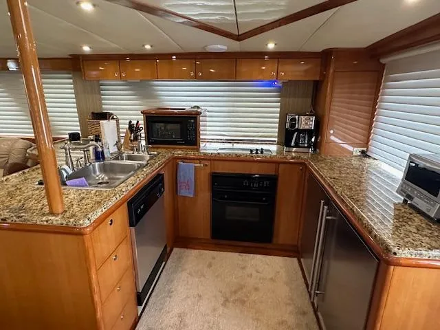 Slide: The Image of Luxurious kitchen interior of 2000 Jefferson Marquessa 60 MY yacht with modern appliances. - 9