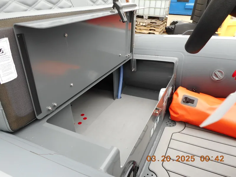 Slide: The Image of Open storage compartment in 2025 Highfield Sport 390 boat interior. - 5