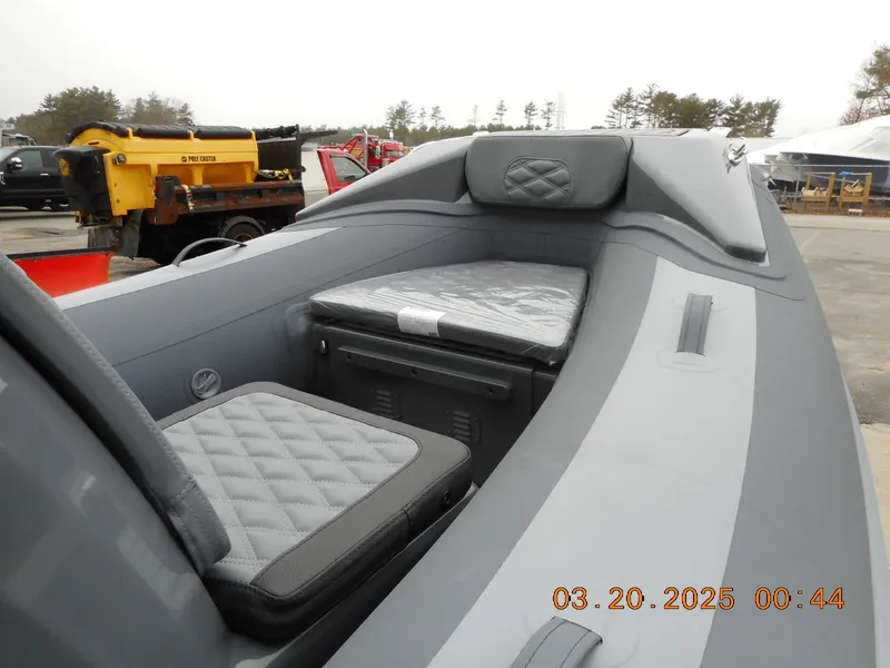 Slide: The Image of 2025 Highfield Sport 390 boat interior with cushioned seating and modern design. - 7