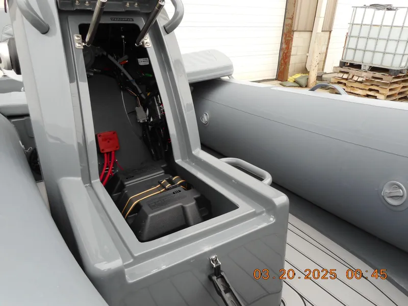 Slide: The Image of 2025 Highfield Sport 390 boat interior showing battery compartment and wiring. - 8