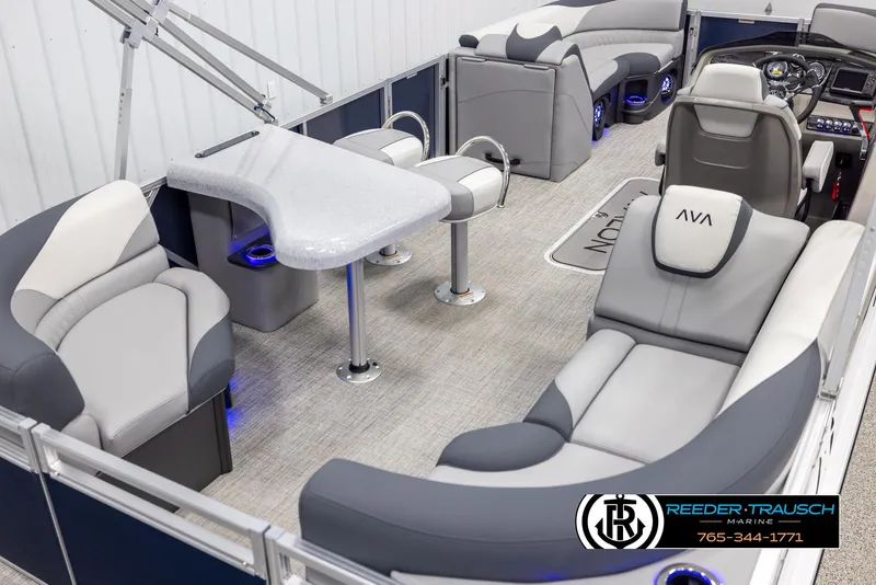 Slide: The Image of Luxurious 2025 Avalon LSZ Entertainer pontoon boat interior with plush seating and modern amenities. - 12