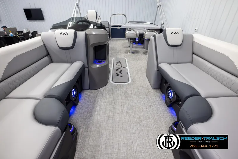 Slide: The Image of Luxurious interior of 2025 Avalon LSZ Entertainer pontoon boat with modern seating and blue LED lighting. - 13