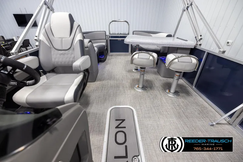 Slide: The Image of 2025 Avalon LSZ Entertainer boat interior with modern seating and sleek design. - 14