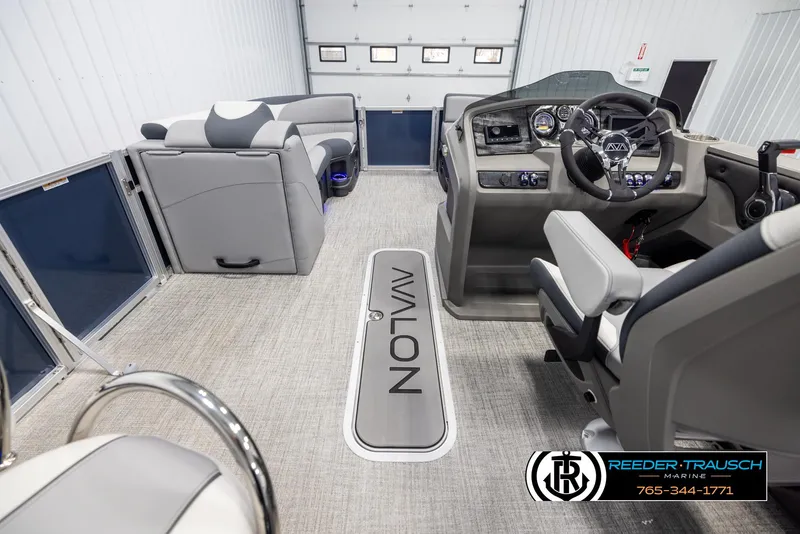 Slide: The Image of Interior of 2025 Avalon LSZ Entertainer pontoon boat with modern seating and control panel. - 17