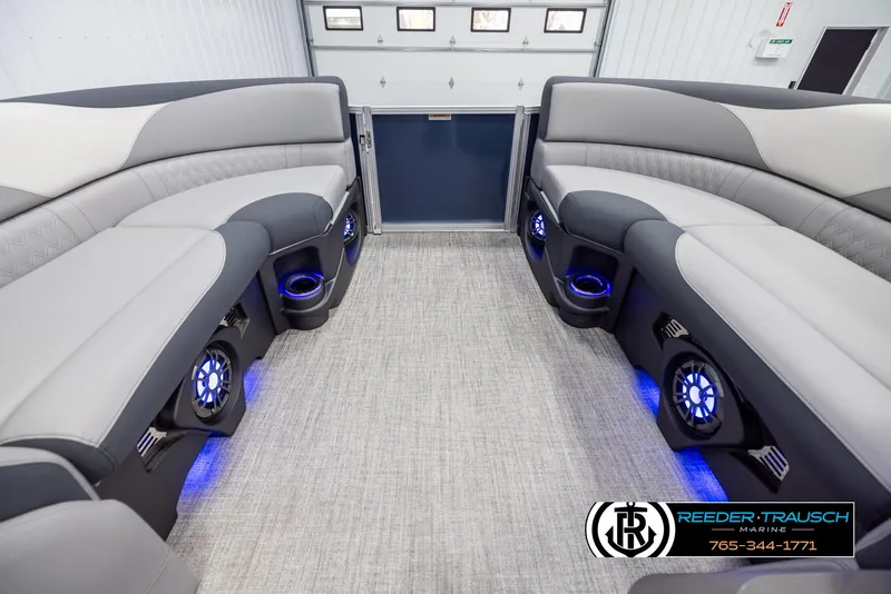 Slide: The Image of Luxurious interior of 2025 Avalon LSZ Entertainer pontoon boat with LED lighting and plush seating. - 18