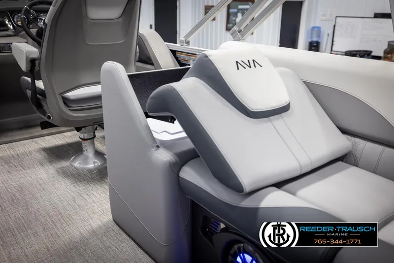 Slide: The Image of 2025 Avalon LSZ Entertainer boat interior with modern seating and steering area. - 23