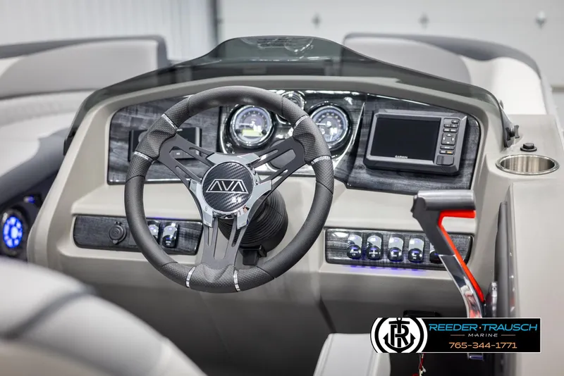 Slide: The Image of 2025 Avalon LSZ Entertainer dashboard with steering wheel, gauges, and navigation system. - 24