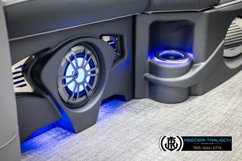 Slide: The Image of 2025 Avalon LSZ Entertainer boat interior with illuminated speaker and cup holder. - 39