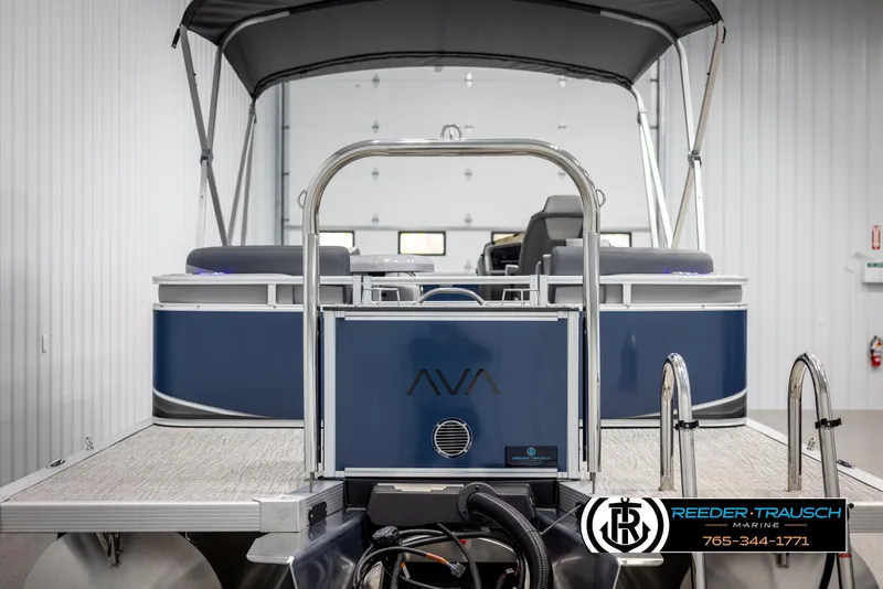 Slide: The Image of 2025 Avalon LSZ Entertainer pontoon boat in showroom, featuring sleek design and modern amenities. - 7