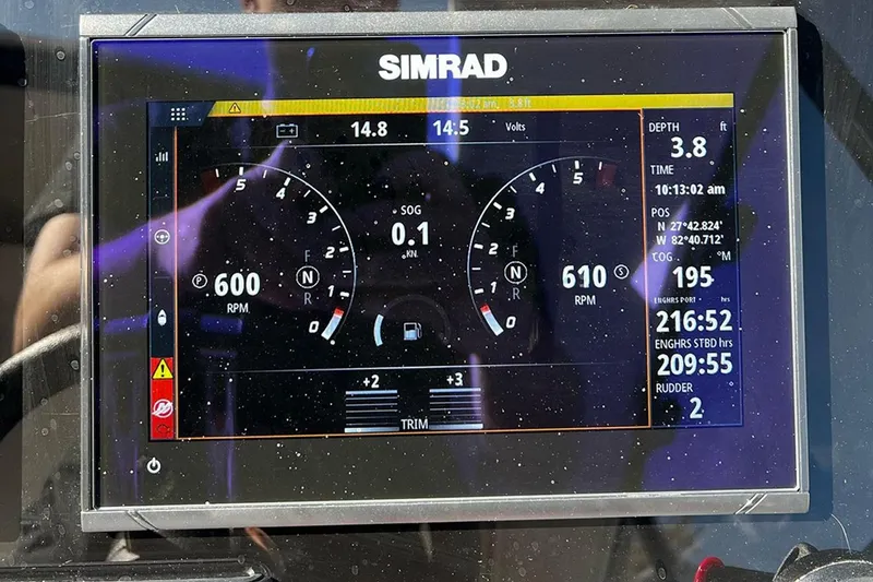 Slide: The Image of Simrad marine display showing engine RPM, depth, and navigation data on Hanover 375, 2024 model. - 10