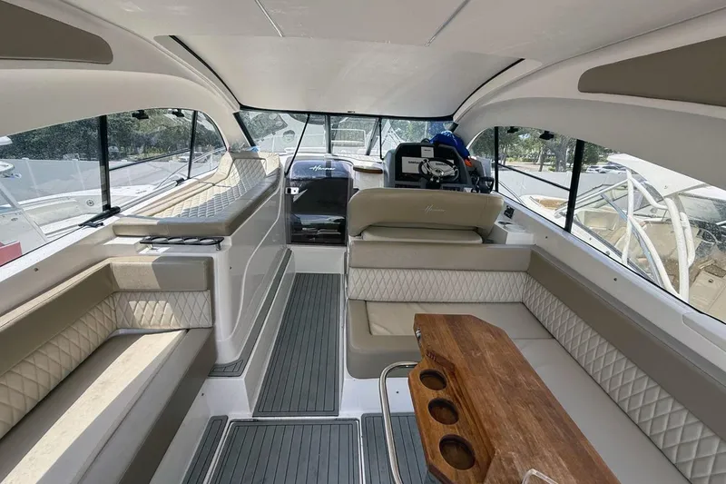 Slide: The Image of Luxurious interior of 2024 Hanover 375 yacht with elegant seating and wooden table. - 8
