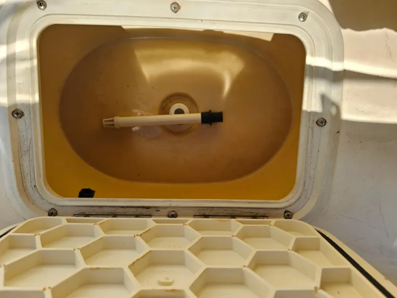 Slide: The Image of Livewell compartment in a 2002 Sea Pro SV2100CC Bay Boat, open with hexagonal lid design. - 24