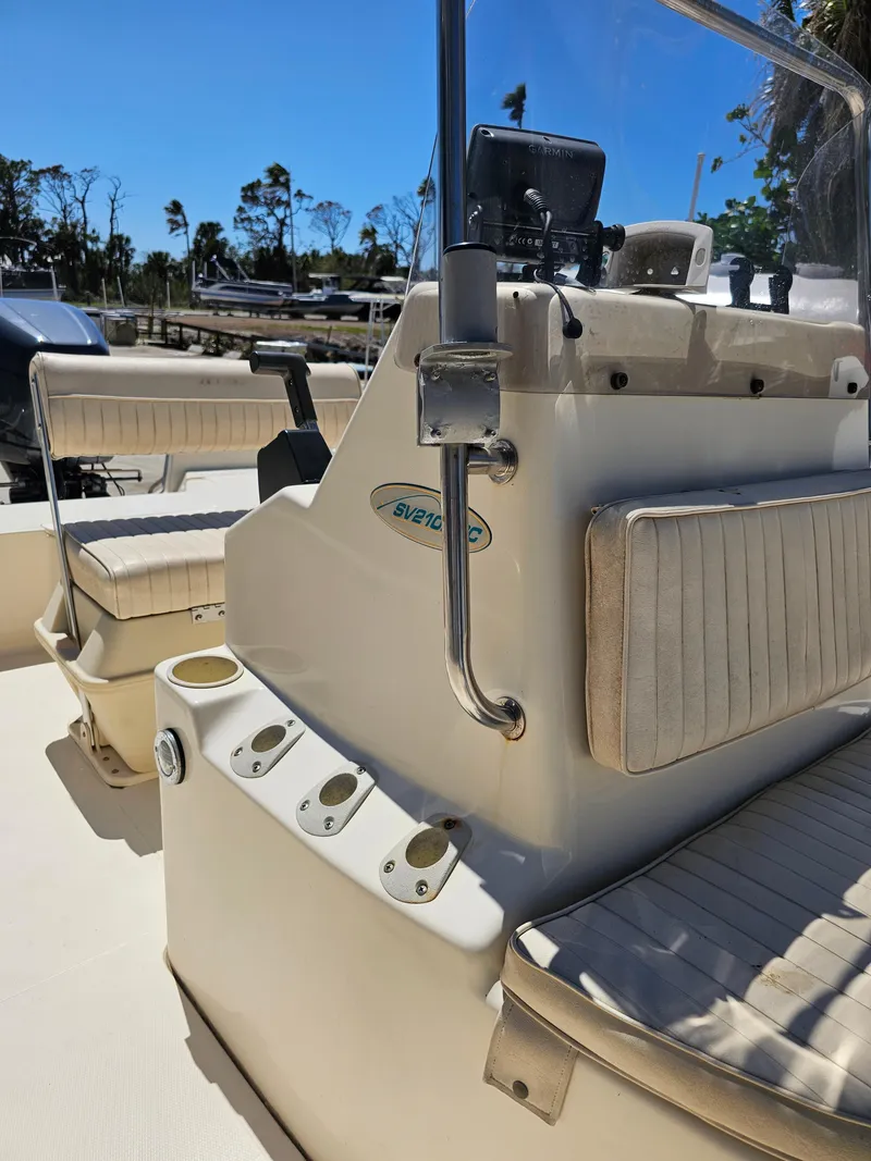 Slide: The Image of 2002 Sea Pro SV2100CC Bay Boat interior with seating and console details. - 27