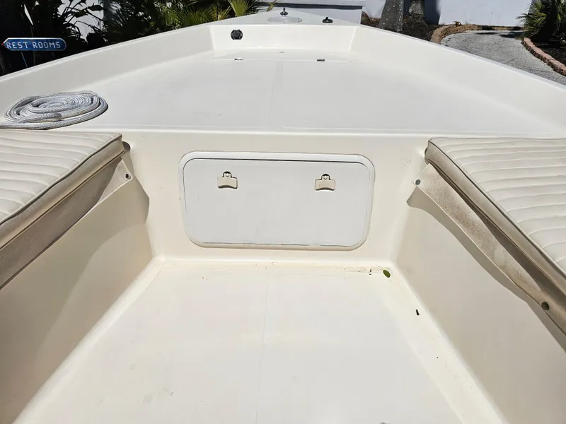 Slide: The Image of 2002 Sea Pro SV2100CC Bay Boat interior with storage compartment and seating. - 30