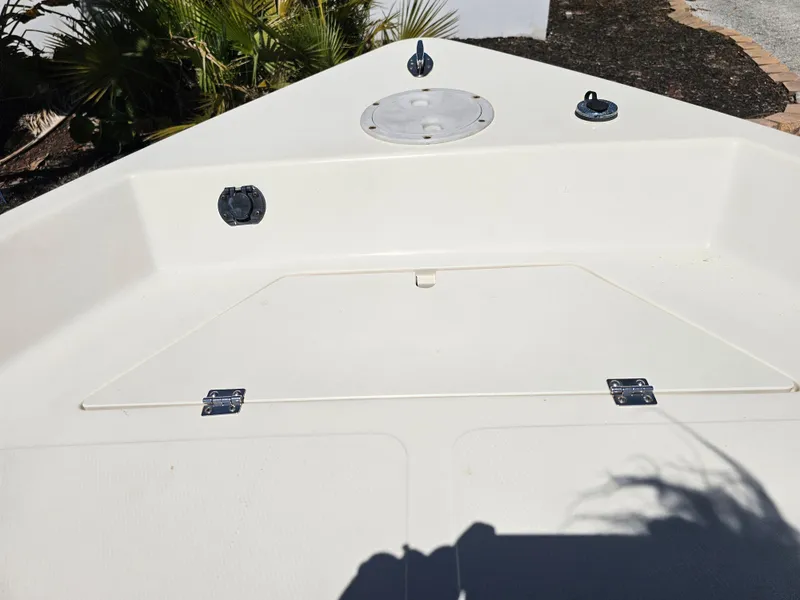 Slide: The Image of 2002 Sea Pro SV2100CC Bay Boat deck with storage compartment and fittings. - 32