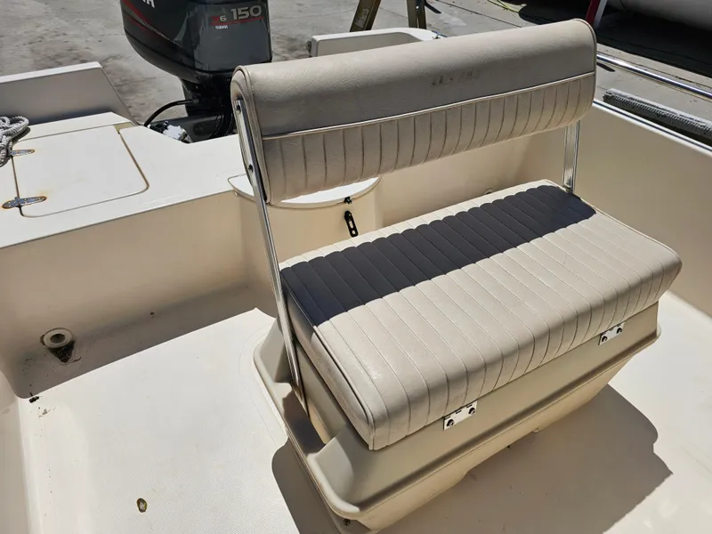 Slide: The Image of 2002 Sea Pro SV2100CC Bay Boat with cushioned seating and Yamaha V6 150 engine. - 34