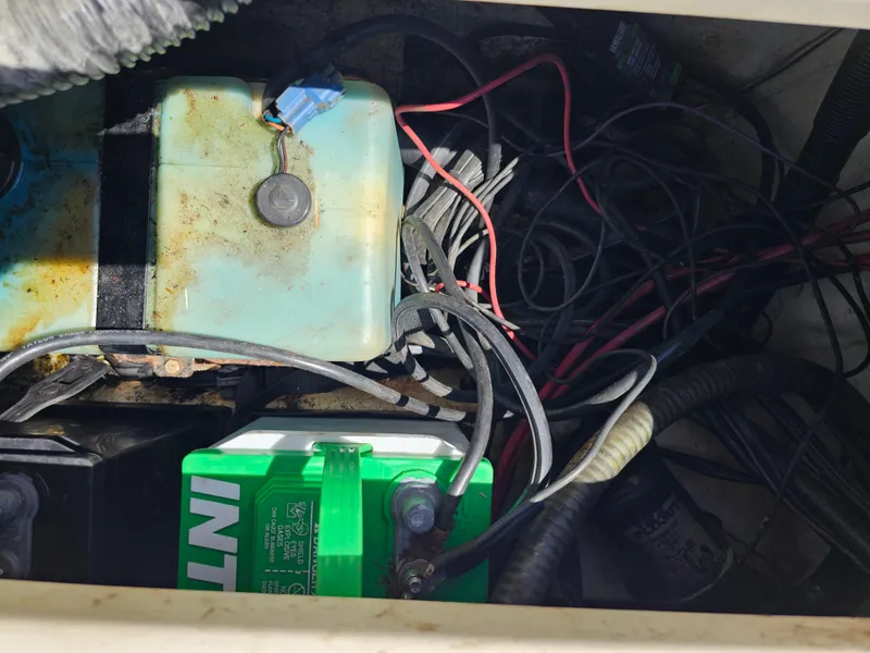 Slide: The Image of 2002 Sea Pro SV2100CC Bay Boat battery compartment with wiring and components. - 38