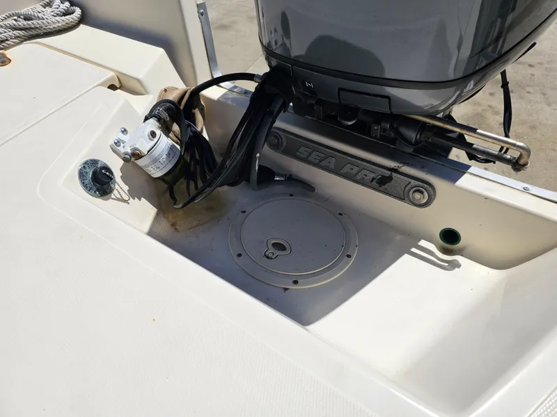 Slide: The Image of 2002 Sea Pro SV2100CC Bay Boat engine area with visible wiring and components. - 41