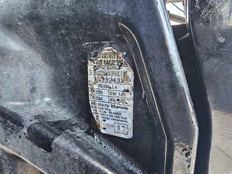 Slide: The Image of Close-up of a worn identification plate on a 2012 Boston Whaler 210 Montauk boat. - 12