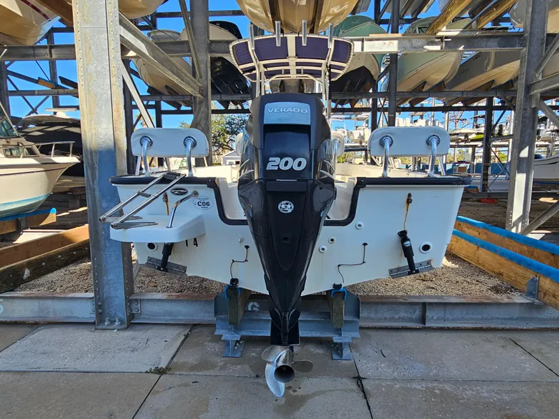 Slide: The Image of 2012 Boston Whaler 210 Montauk with 200 Verado engine in storage facility. - 14