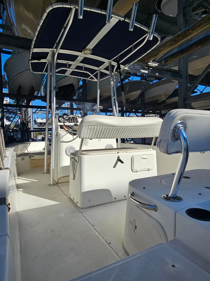 Slide: The Image of 2012 Boston Whaler 210 Montauk boat interior with seating and console. - 17