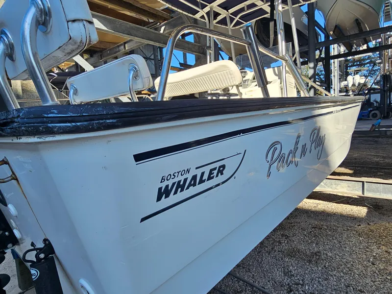 Slide: The Image of 2012 Boston Whaler 210 Montauk boat on trailer, side view. - 2