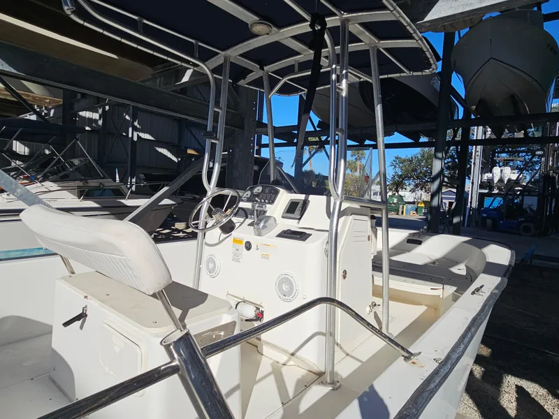 Slide: The Image of 2012 Boston Whaler 210 Montauk boat interior with steering console and seating. - 20