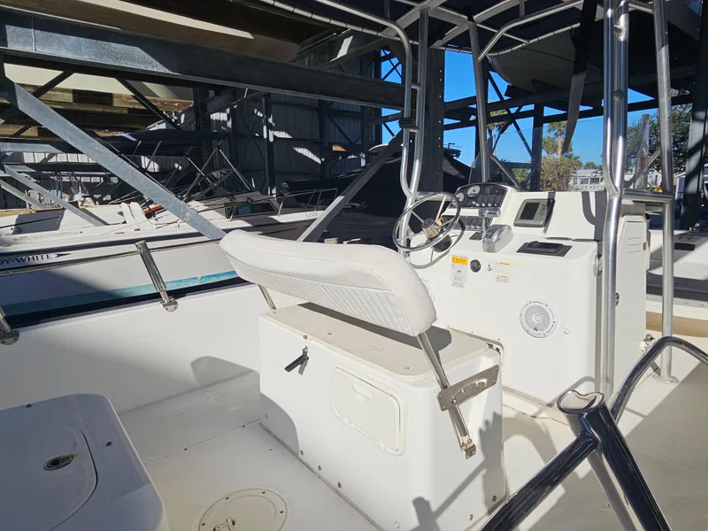 Slide: The Image of 2012 Boston Whaler 210 Montauk boat interior with steering console and seating. - 24