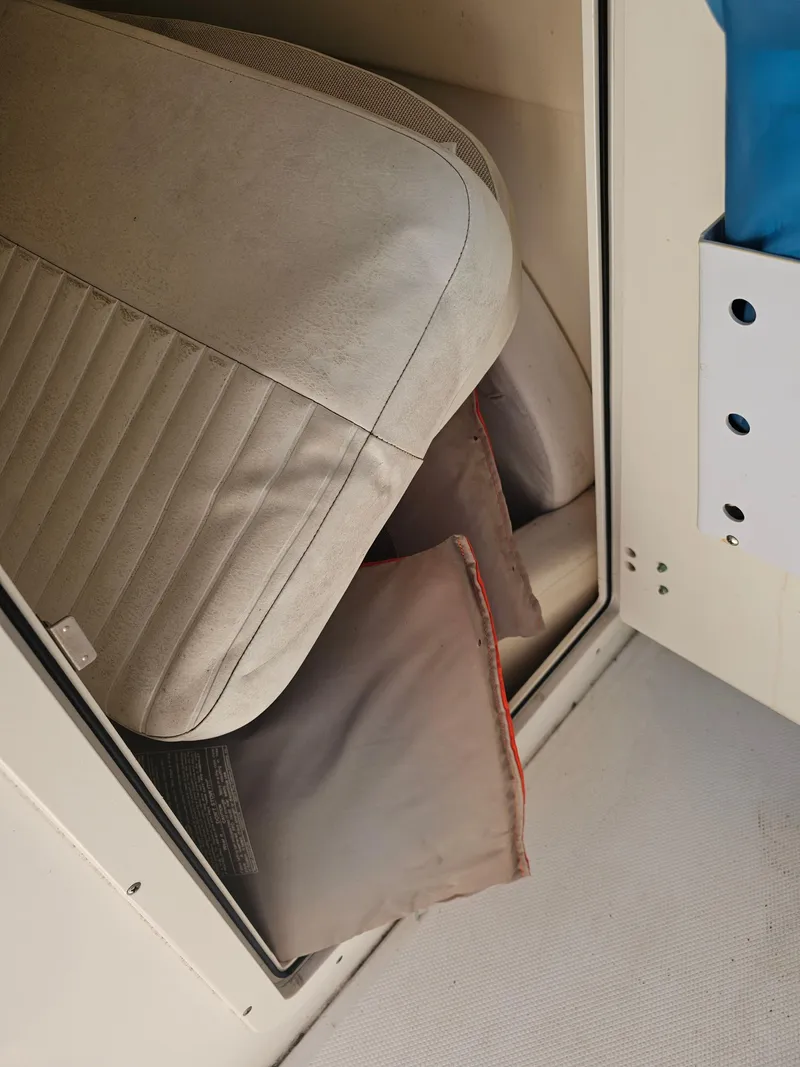 Slide: The Image of Storage compartment with cushions on a 2012 Boston Whaler 210 Montauk boat. - 26